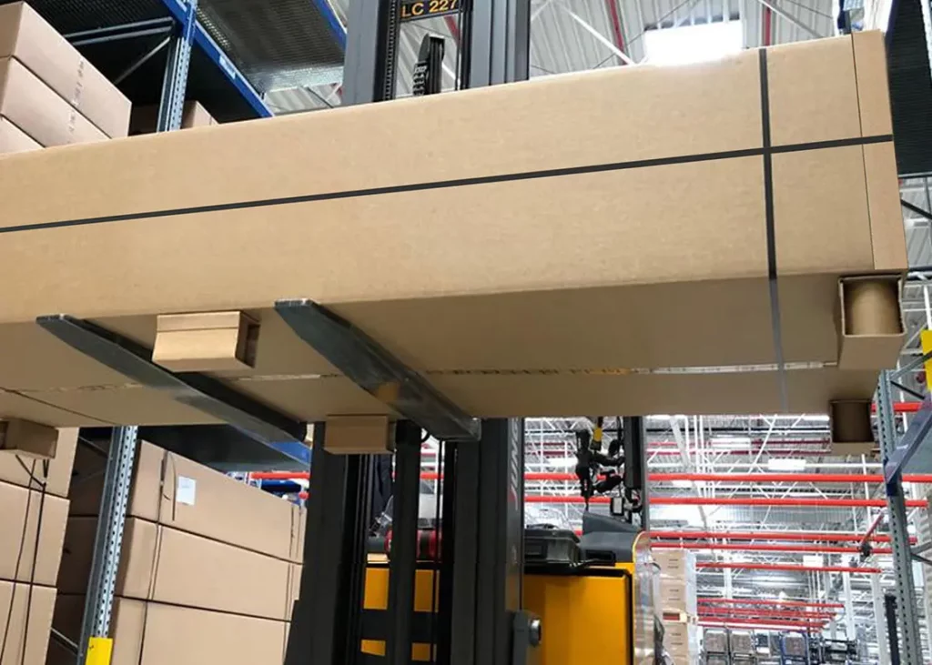 Big cardbox with Pallet runners lifted with forklift